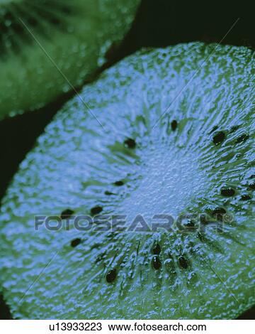 Stock Image - Half Cut Kiwi, High Angle View, Close Up, Differential Focus, In Focus, Out Focus. Fotosearch