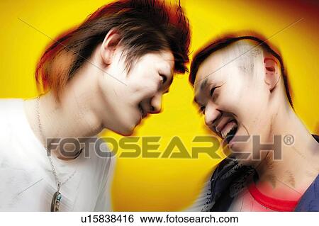 Stock Photograph - Two Young Adult Man Smling at Each Other, Photography, Side View, Blurred Motion. Fotosearch