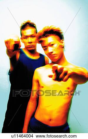 Picture - Two Young Adult Men Pointing at Camera, Photography, CG, Front View, Toned Image. Fotosearch