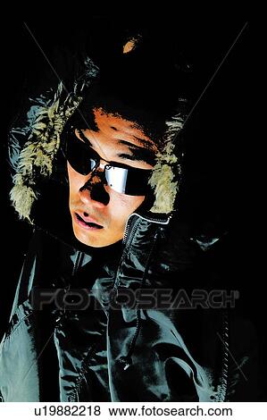 Young Adult Man in Hooded Coat and Sunglasses, Photography, CG, High Angle View, Toned Image View Large Photo Image Stock Photo - Young Adult Man in Hooded Coat and Sunglasses, Photography, CG, High Angle View, Toned Image. Fotosearch