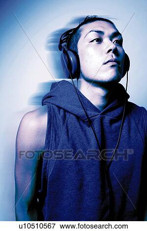 Young Adult Man Listening to Music, Photography, CG, Front View, Side View, Toned Image View Large Photo Image Stock Photo - Young Adult Man Listening to Music, Photography, CG, Front View, Side View, Toned Image. Fotosearch