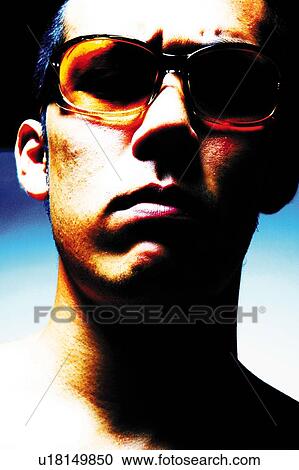 Stock Image - Young Adult Man Looking at Camera, Photography, Front View, Close Up. Fotosearch