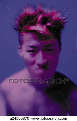 Stock Image - Young Adult Man Looking at Camera, Photography, CG, Front View, Toned Image, Differential Focus. Fotosearch