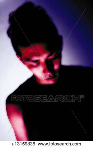 Young Adult Man Looking Down, Photography, Front View, Soft Focus, Toned Image View Large Photo Image Stock Photograph - Young Adult Man Looking Down, Photography, Front View, Soft Focus, Toned Image. Fotosearch