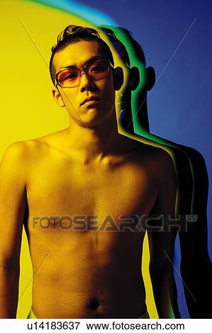 Stock Photo - Young Adult Man Posing, Photography, CG, Composite, Front View, Toned Image. Fotosearch