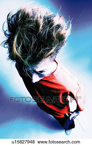 Young Adult Man Posing, Photography, High Angle View, Toned Image View Large Photo Image Stock Photo - Young Adult Man Posing, Photography, High Angle View, Toned Image. Fotosearch