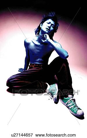 Young Adult Man Posing, Photography, CG, Low Angle View, Toned Image View Large Photo Image Stock Photo - Young Adult Man Posing, Photography, CG, Low Angle View, Toned Image. Fotosearch