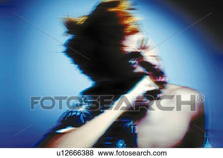 Stock Photo - Young Adult Man Punching Himself, Photography, CG, Front View, Blurred Motion, Toned Image. Fotosearch
