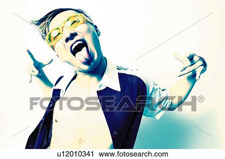 Young Adult Man Putting Out Tongue, Photography, Front Angle View, Toned Image View Large Photo Image Stock Image - Young Adult Man Putting Out Tongue, Photography, Front Angle View, Toned Image. Fotosearch