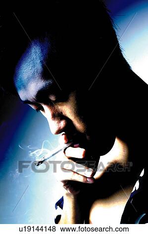 Young Adult Man Smoking, Photography, Side View, Toned Image View Large Photo Image Stock Photo - Young Adult Man Smoking, Photography, Side View, Toned Image. Fotosearch