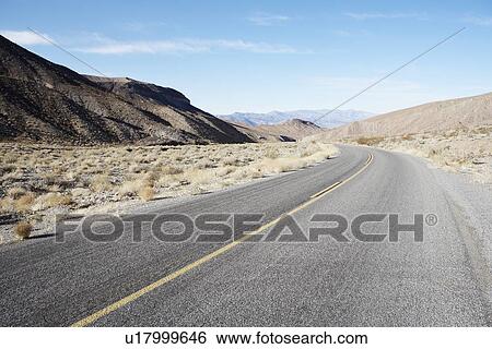 Stock Photograph - Empty highway in desert, Death Valley, California, USA. Fotosearch