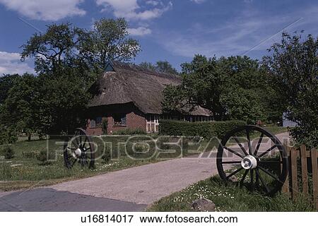 Stock Photo - The House With A Straw-Thatched Roof In Britain. Fotosearch