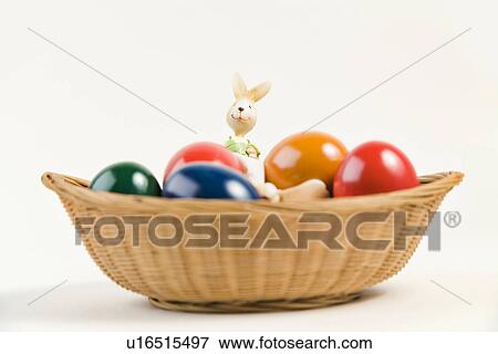 Stock Photo - osternest, freigestellt, alfred, aliment, colored, colorful. Fotosearch