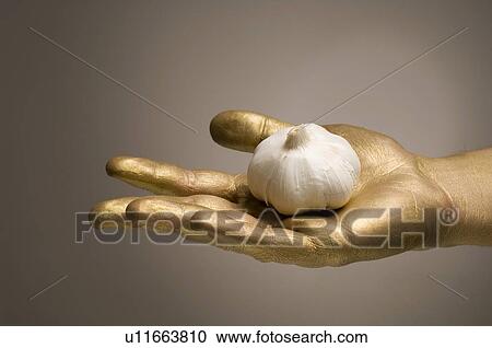 Stock Image - gilded, gilt, gold, golden, hand, goldy, human. Fotosearch