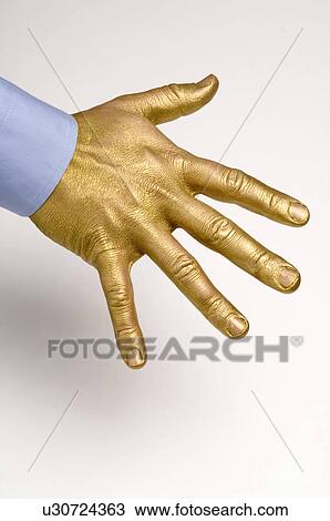 Stock Image - gilded, gilt, gold, golden, hand, goldy, human. Fotosearch