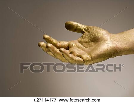 Stock Photo - gilded, gilt, gold, golden, hand, goldy, human. Fotosearch