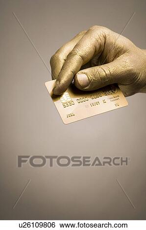 Stock Photograph - gilded, gilt, gold, golden, hand, goldy, human. Fotosearch