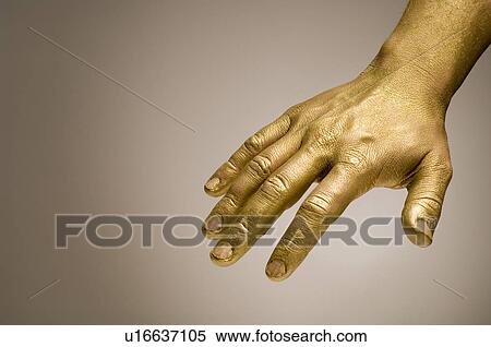 Stock Photography - gilded, gilt, gold, golden, hand, goldy, human. Fotosearch