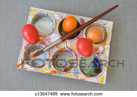 Stock Photo - orange, aufischt, Easter eggs, Easter, colored, ariane. Fotosearch