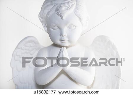 Stock Photo - Christmas, angel, Christianity, cherub, catholic, feastful, advent. Fotosearch