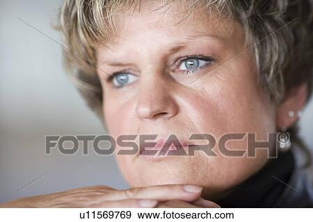 Stock Photo - contemplative, black, close-up, brunette, brown, adults. Fotosearch