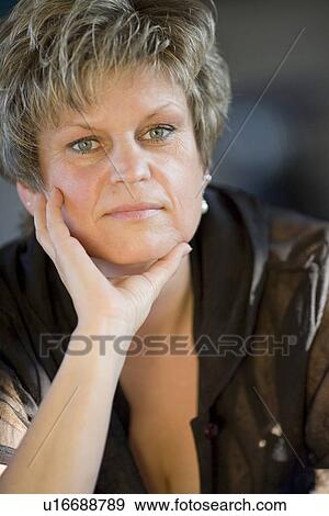 Stock Photo - day, brown, contemplative, close-up, brunette, adults. Fotosearch