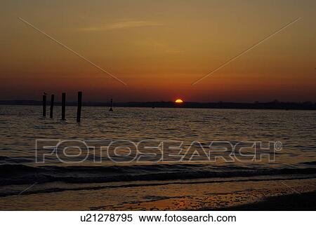 Stock Photography - stairway, buoy, surge, breakers, sky, sea, morning. Fotosearch