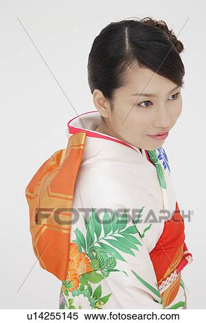 Stock Photography - Portrait of a teenage girl in traditional outfit. Fotosearch
