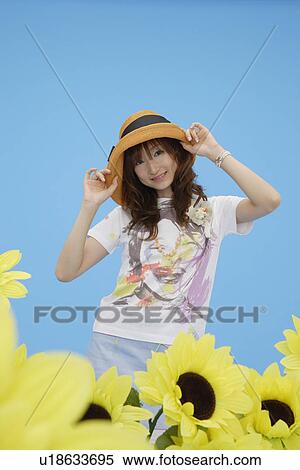Stock Photography - Portrait of a teenage girl wearing a hat. Fotosearch