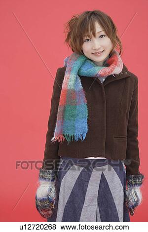 Portrait of a teenager girl wearing a muffler View Large Photo Image Stock Photo - Portrait of a teenager girl wearing a muffler. Fotosearch