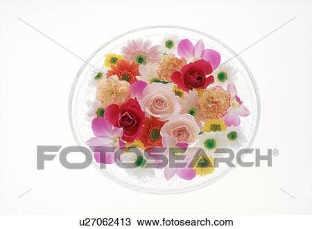 Stock Image - View of colorful flowers in a bowl. Fotosearch