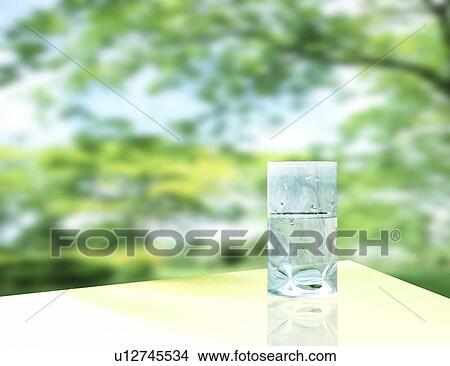 View of a glass of water on table View Large Photo Image Picture - View of a glass of water on table. Fotosearch