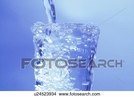 View of falling water in glass View Large Photo Image Picture - View of falling water in glass. Fotosearch