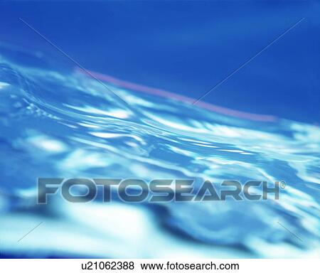 View of waves on water surface View Large Photo Image Stock Photo - View of waves on water surface. Fotosearch
