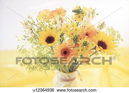 Stock Photograph - Close-up of a bunch of sunflowers in a vase. Fotosearch