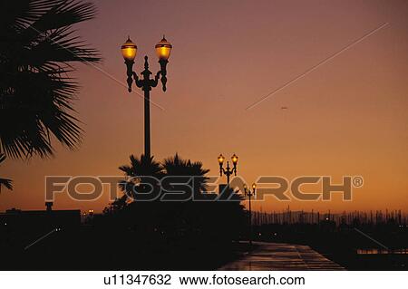 Stock Image - Evening Glow And Streetlight In The United States. Fotosearch