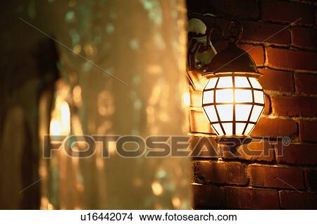 Picture - Lamp On Brick Wall. Fotosearch
