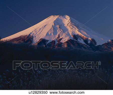 Stock Image - Sun Setting On Mount Fuji. Fotosearch