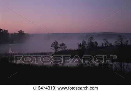 Stock Photo - The Lake In A Morning Glow. Fotosearch
