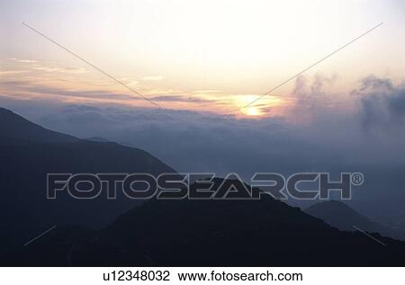 The Morning Sun And A Mountain Range View Large Photo Image Stock Image - The Morning Sun And A Mountain Range. Fotosearch