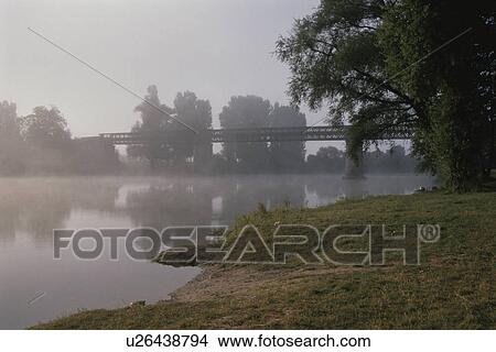 Picture - The Morning Sun And The River In France. Fotosearch