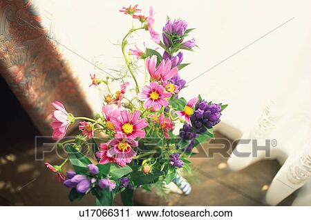 Flower bouquet by window View Large Photo Image Stock Image - Flower bouquet by window. Fotosearch