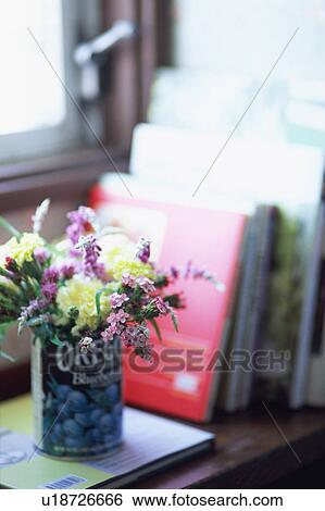 Flower bouquet in can and books View Large Photo Image Stock Photograph - Flower bouquet in can and books. Fotosearch