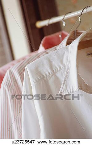 Stock Photo - Blouses in closet. Fotosearch