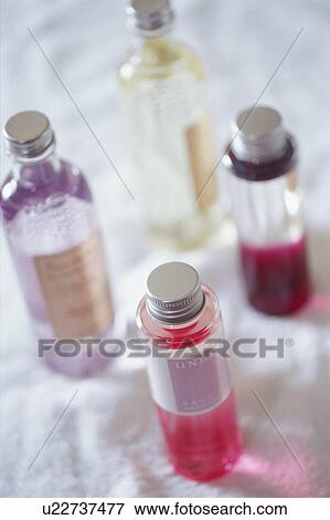 Bottles of bath oils View Large Photo Image Stock Photo - Bottles of bath oils. Fotosearch