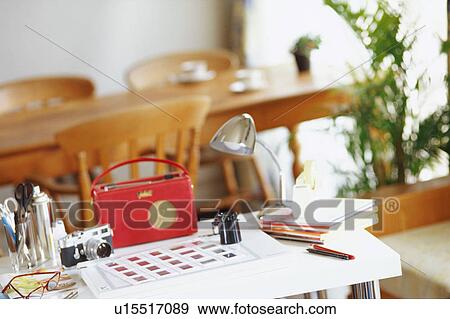 Stock Photo - Camera and slides on table. Fotosearch