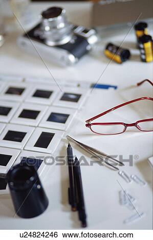Stock Photograph - Camera and slides. Fotosearch