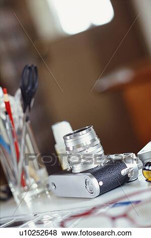 Stock Photo - Camera and stationeries. Fotosearch