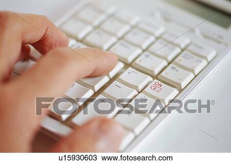 Stock Image - Close-up of keyboard with human hand. Fotosearch