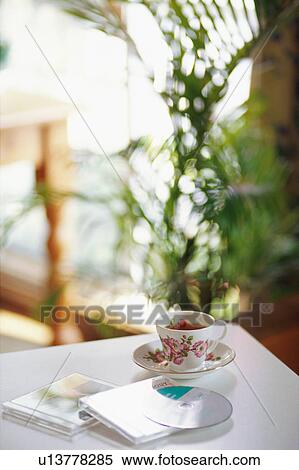 Cup of tea and CDs View Large Photo Image Stock Photography - Cup of tea and CDs. Fotosearch